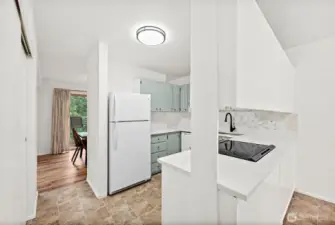 Updated granite countertops with a new kitchen sink, plus a spacious pantry to store all your cooking essentials