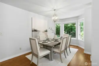 Adjacent dining room with a swinging door leading to the kitchen.