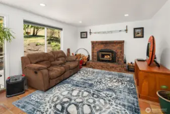 sit near the fireplace in this incredibly cozy living room