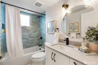Shared upper bath. Upper level laundry is present but not pictured.