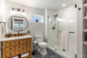 ADU/lower level bath. Laundry is present but not pictured.