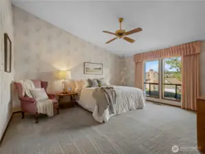 The primary suite has room for a king sized bed set and seating area.