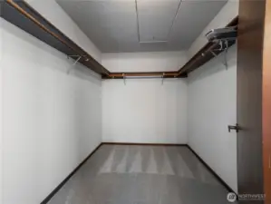 There is ample space in the primary's walk in closet.