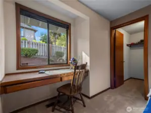 From the desk area you have a view of the beautifully kept backyard.