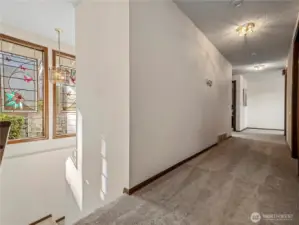 The stair well down to the lower level is also filled with natural light with 2 more large windows.