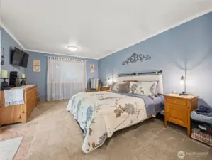 Primary bedroom with French doors leading to outside