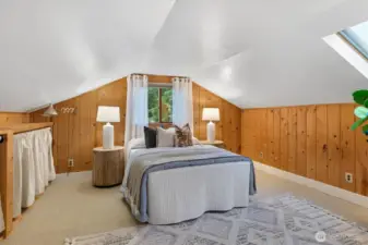 The upstairs bedroom, part of a two-room suite which is a hallmark of Lovell homes.
