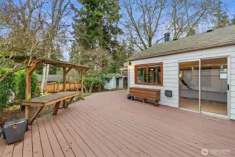 Large deck and covered bench off the flex room and primary bedroom!