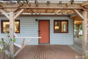 Covered entry to the flex room off of the carport.