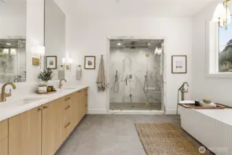 Upstairs primary retreat featuring a double–shower head steam shower, stunning fluted soaking tub, and two closets.