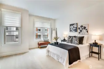 Spacious primary suite with direct patio access, creating a peaceful retreat with easy outdoor connection.