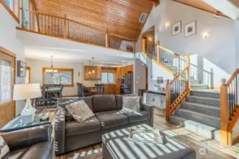 living room looking into kitchen and stair to bedroom 3 & 4