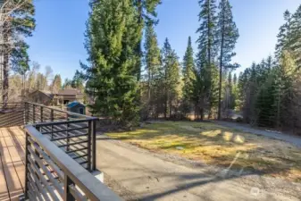front deck includes outdoor furniture and table which is still in storage shed