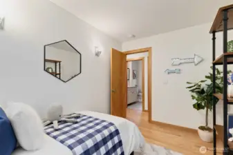 First bedroom directly across from bathroom & linen closet.