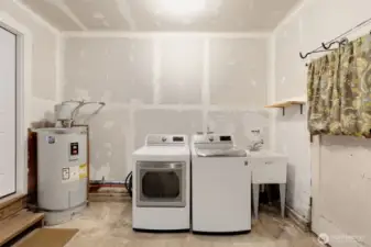Laundry & hot water tank in the garage