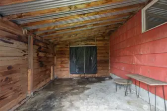 Connected shed/workshop area with power.