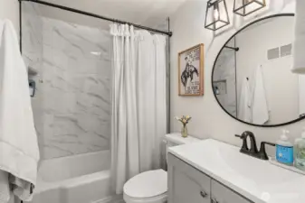 Full bathroom with shower and tub