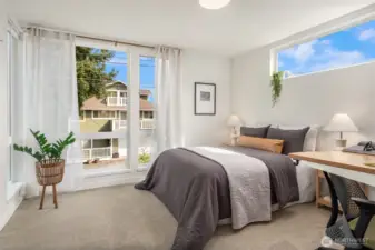 Up the first flight of stairs is the 2nd bedroom. Each bedroom is on its own floor and has its own bath, which means the home lives beautifully whether the buyer wants an elevated guest setup, roommate flexibility, a polished work-from-home arrangement, or simply some breathing room.