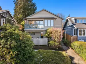 Incredibly versatile living atop Queen Anne's northwest hill!  2nd kitchen & separate entrance offer ADU potential.  Garage off alley opens directly into the main floor, offering one-level living.