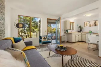 The cute kitchen has room for a little bistro table, and enjoys lovely light thanks to abundant windows.