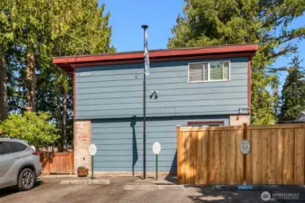 Exterior side of building seen from street & parking