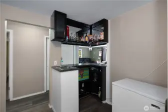 Wet bar that flows sleamlessly into living room.