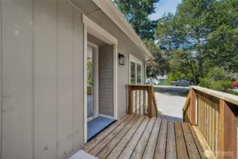 Front deck leads to both front & back yards.