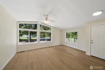 LOVING the light that floods this room from those large windows.