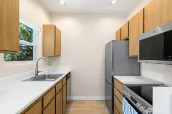 Kitchen just updated with new Countertops, plus new Microwave, Fridge, and Stove.
