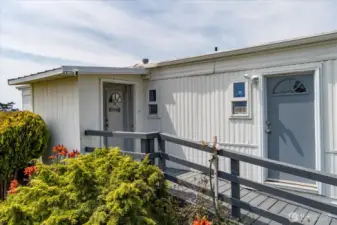 The covered entry makes the perfect place to kick off your shoes & prep to go inside.