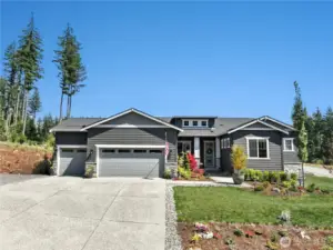 Welcome to this immaculate rambler on a one-acre corner lot!
