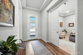 Grand entryway with 10' tray ceilings. Double doors to office or flex space
