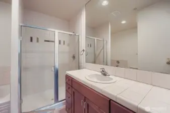 4-piece ensuite bath with bathtub, shower, toilet and vanity.