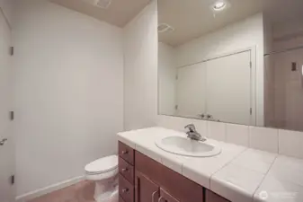 Functional bath design with ample counter space and storage.