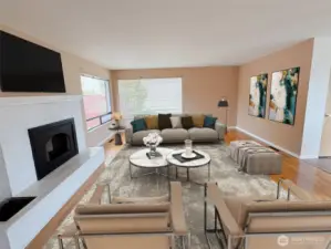 Living room has large picture windows and an electric fireplace