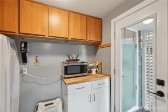 Utility room with storage space.  Just outside the door of the utility room is the laundry closet.