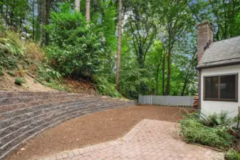 Patio and back yard with a new retaining wall.