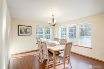 Open dining room flooded with natural lighting.