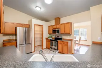 Easy transition space from the kitchen to the dining room creates an easy work flow for home chefs.