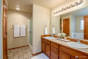 Gorgeous primary bathroom with dual vanity and walk in shower.