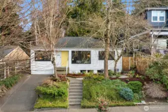 A renovated 1940's Ravenna bungalow, cherishes wide plank hard wood flooring throughout main floor-from a World War II Armory proving warmth & history, picturesque living room window and new-fresh interior paint, cathedral ceilings, updated systems with A/C, gas range and private-serene back yard.