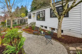 Beautiful landscaping surround this renovated 1940's Ravenna Bungalow. A quiet-established neighborhood with off street parking, fully fenced in yard and a striking evergreen tree in the backyard.