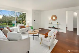 This West facing-renovated 1940's Ravenna bungalow, cherishes wide plank hard wood flooring throughout main floor from a World War II Armory proving warmth and history, picturesque living room window, and all new-fresh interior paint.