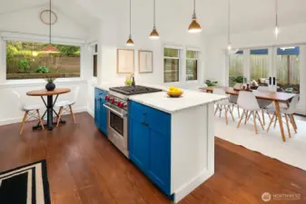 Bright kitchen with Carrera marble counters, Wolf Gas Range, stainless appliances, walk in pantry.... a wonderful entertainers kitchen and dining area!