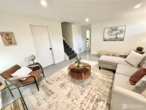 Lower level great room with modern sleek epoxy covered concrete floors for low maintenance and modern design.