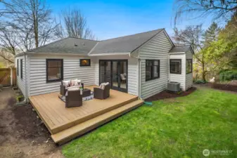 French doors off the dining room to the deck and the private-fully fenced in backyard.