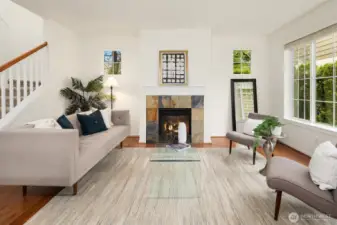 The cozy fireplace is a focal point in this open concept home. There is an office/4th bedroom and 1/2 bath on the main floor and 3 bedrooms and utility room upstairs.