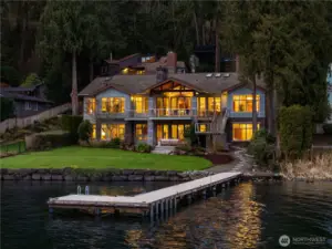 101’ of level Lake Washington waterfront with a 99’ deepwater dock, manicured lawn, and seamless indoor-outdoor living.