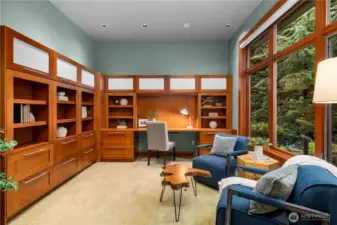 Designed for both productivity and pause—rich wood built-ins, soft natural light, and a serene outlook to the landscape beyond.