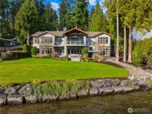 A premier waterfront experience with 101’ of coveted shoreline and a substantial 99’ private dock—offering scale, privacy, and exceptional lake access.